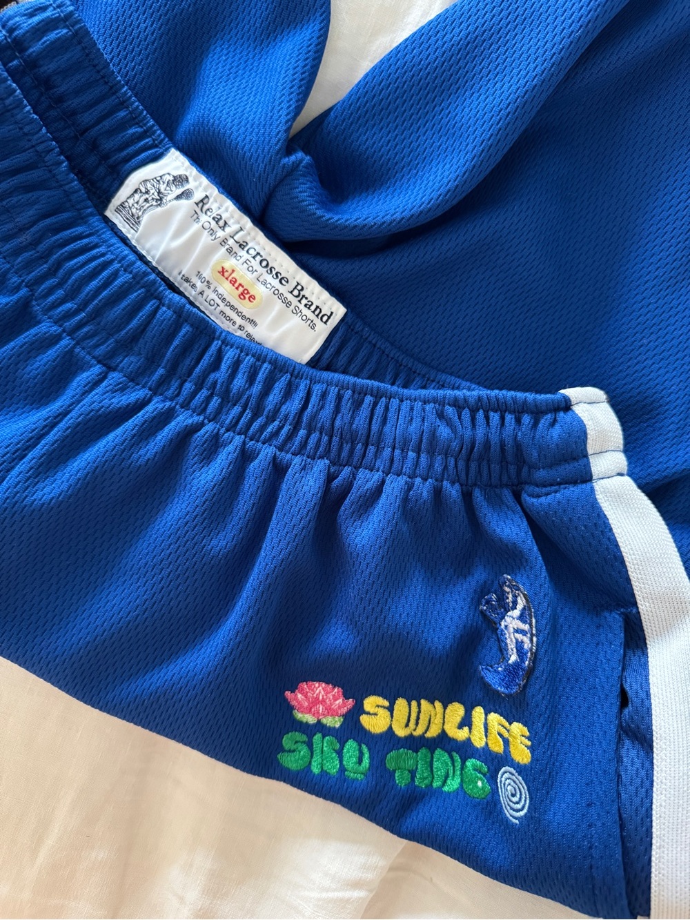 Blue Athletic Shorts with Sunlife Sko Tide Embroidery